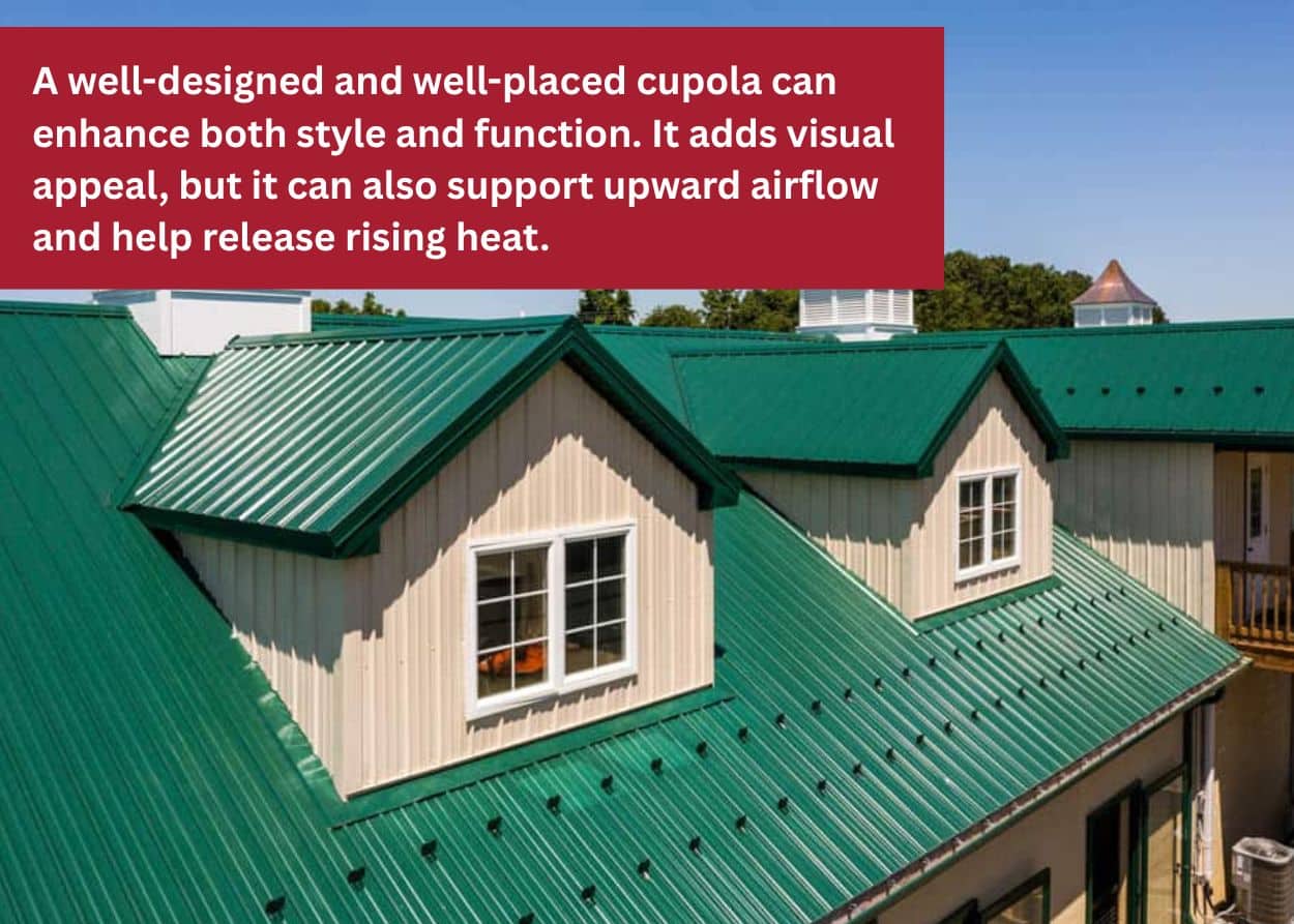 Barn roof with green metal panels and multiple cupolas for ventilation.