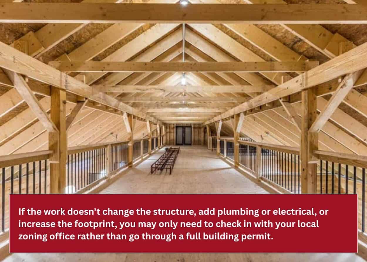 Finished timber-frame horse barn with a spacious loft overlooking the horse stalls below.